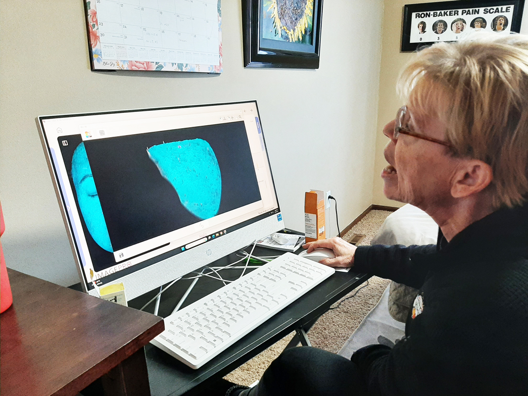 Patty giving an in-depth analysis of a customer's skin using the results from the Skin Analysis Machine